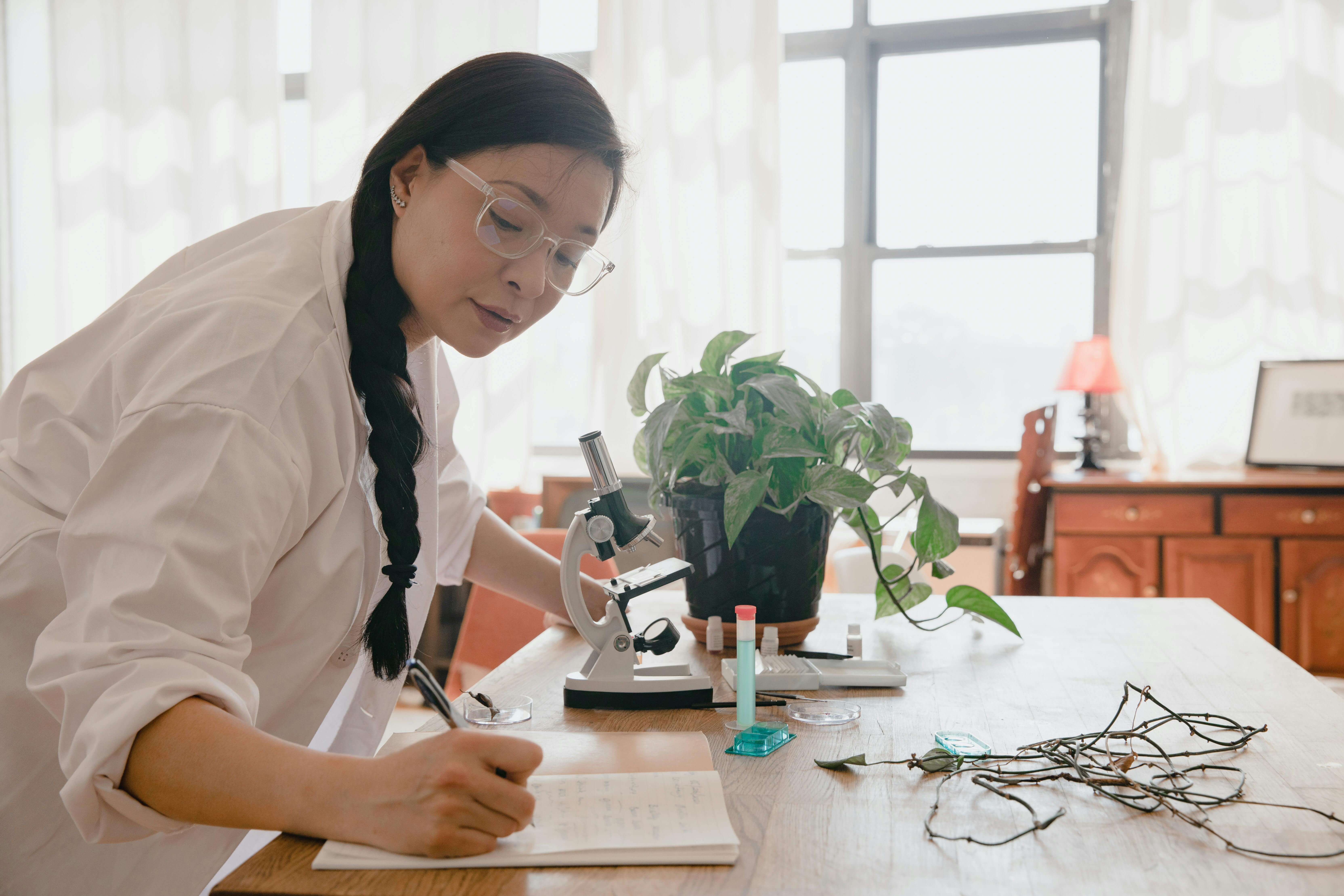 a botanist writing on a notebook